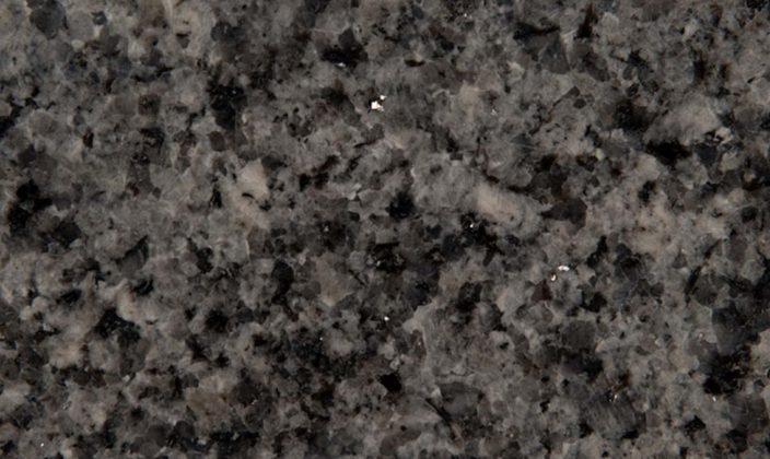 Close-up of a polished granite surface with a mix of black, white, and gray speckled patterns.