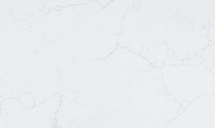White marble surface with subtle gray veining and a smooth, polished texture.