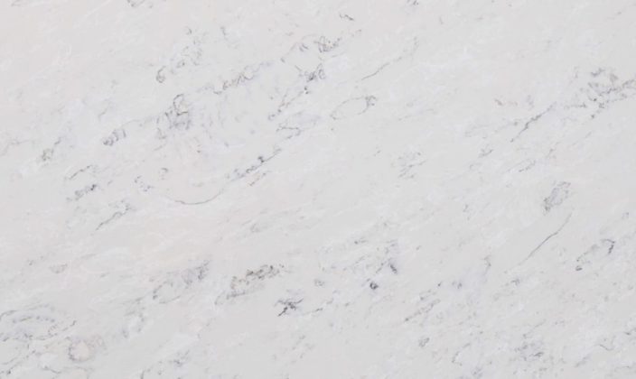 White marble surface with light gray veining and subtle texture.