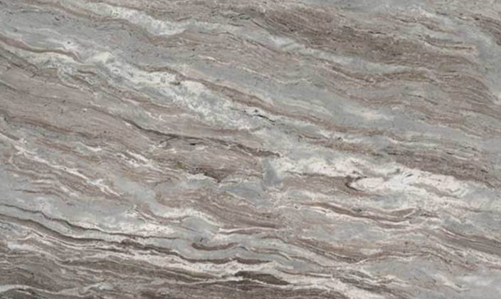 Close-up of a polished marble surface with wavy, layered patterns in shades of gray, beige, and white.