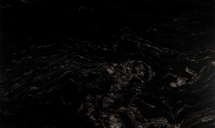 A black marble surface with subtle white and gold veining patterns running across it.